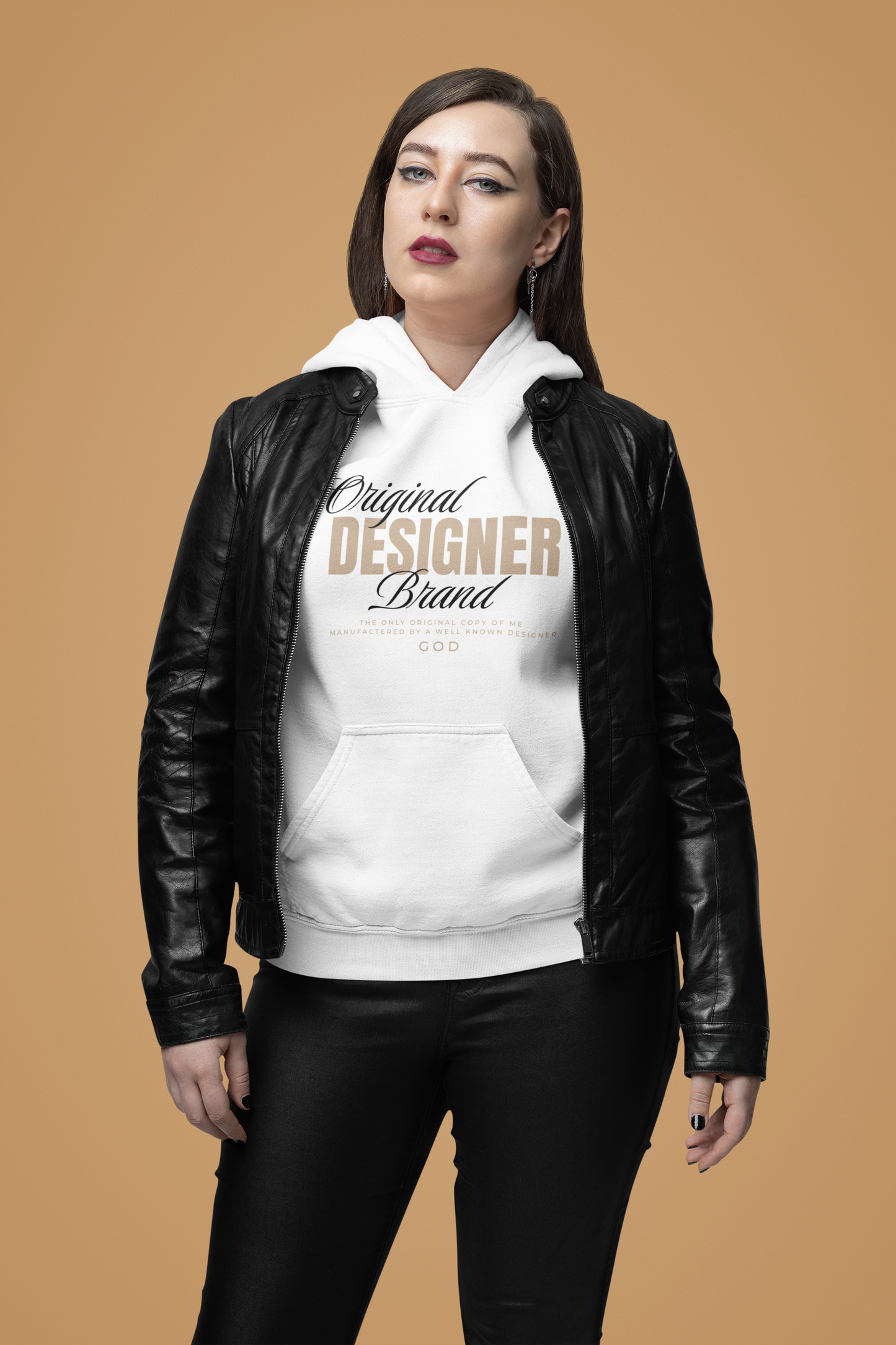 woman wearing white gildan sf500 hoodie with "original designer brand" manufactured by god in tan and black letters in front of tan background. motivated vision