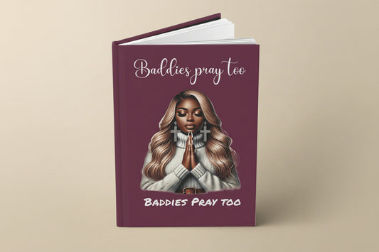 journal book with a cover featuring a illustration of a black woman and text "baddies pray to" on a old mauve color background cover
