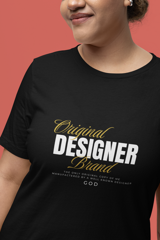 woman wearing black bella canvas 3001 tshirt with "original designer brand manufactured by god" on it motivated vision