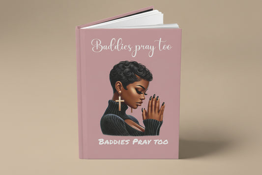 journal book with a cover featuring a illustration of a black woman and text "baddies pray to" on a dusty pink color background cover